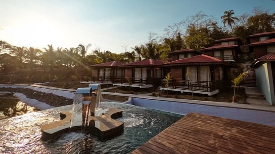 view of the outdoor swimming pool at symphony samudra beachside jungle resort and spa in port Blair