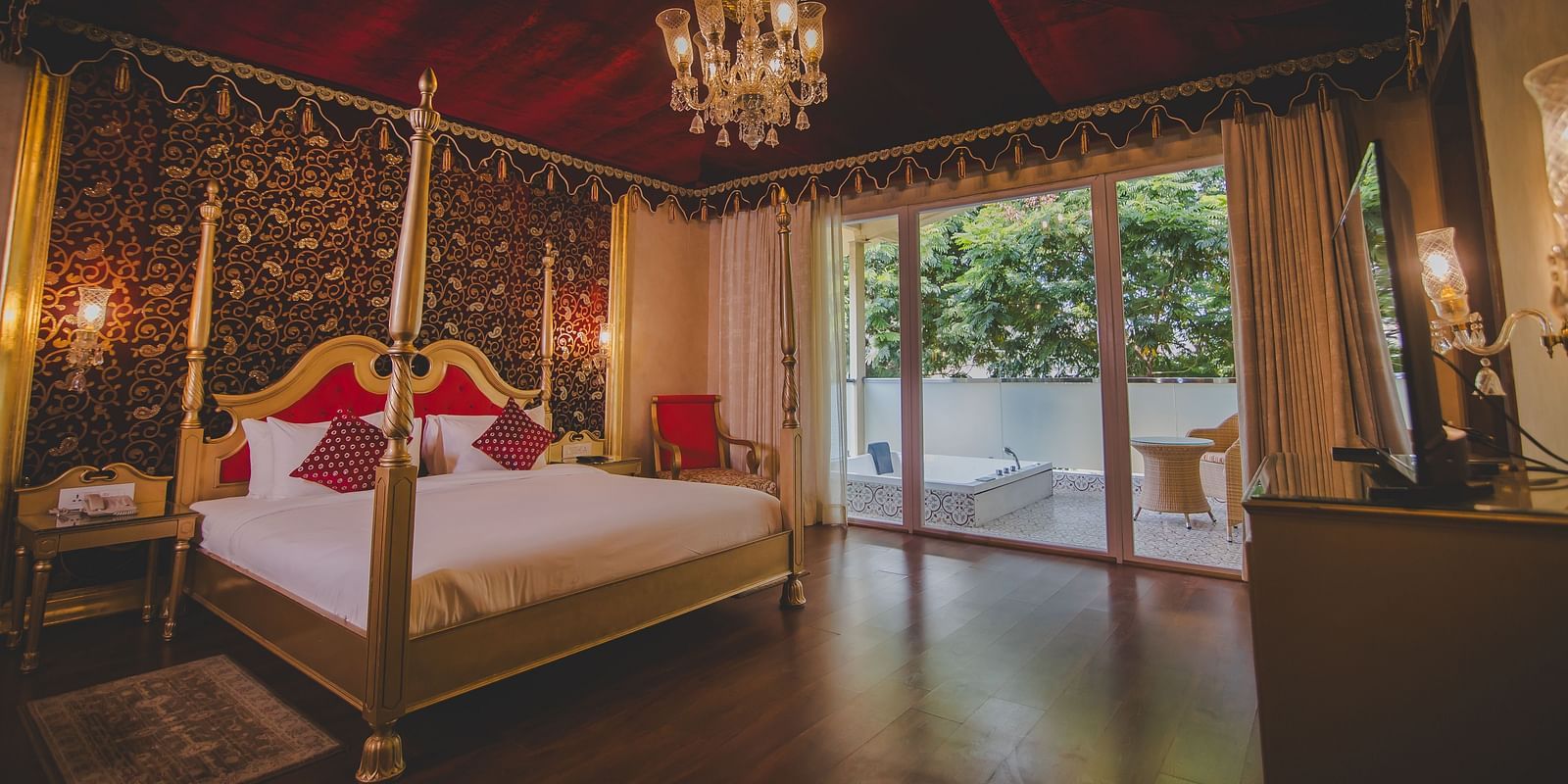 Side view of a room with a bed and a large sliding door on the side at Rajasthali Resort & Spa Jaipur.