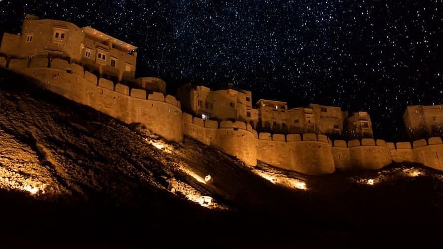 Mehrangarh Fort at night with the light on and under the stars