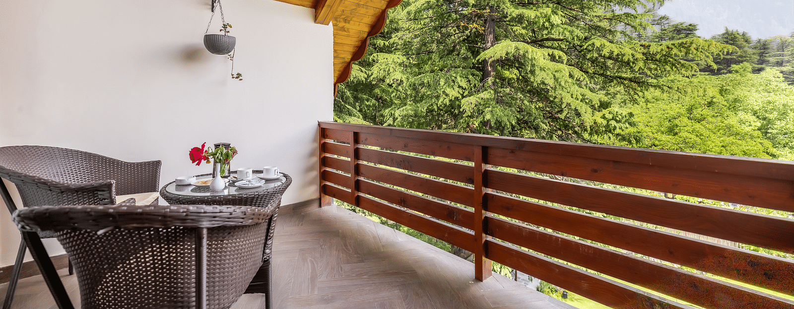 balcony of premium room with a chairs and a view at Bedzz Xclusive Baikunth, Manali