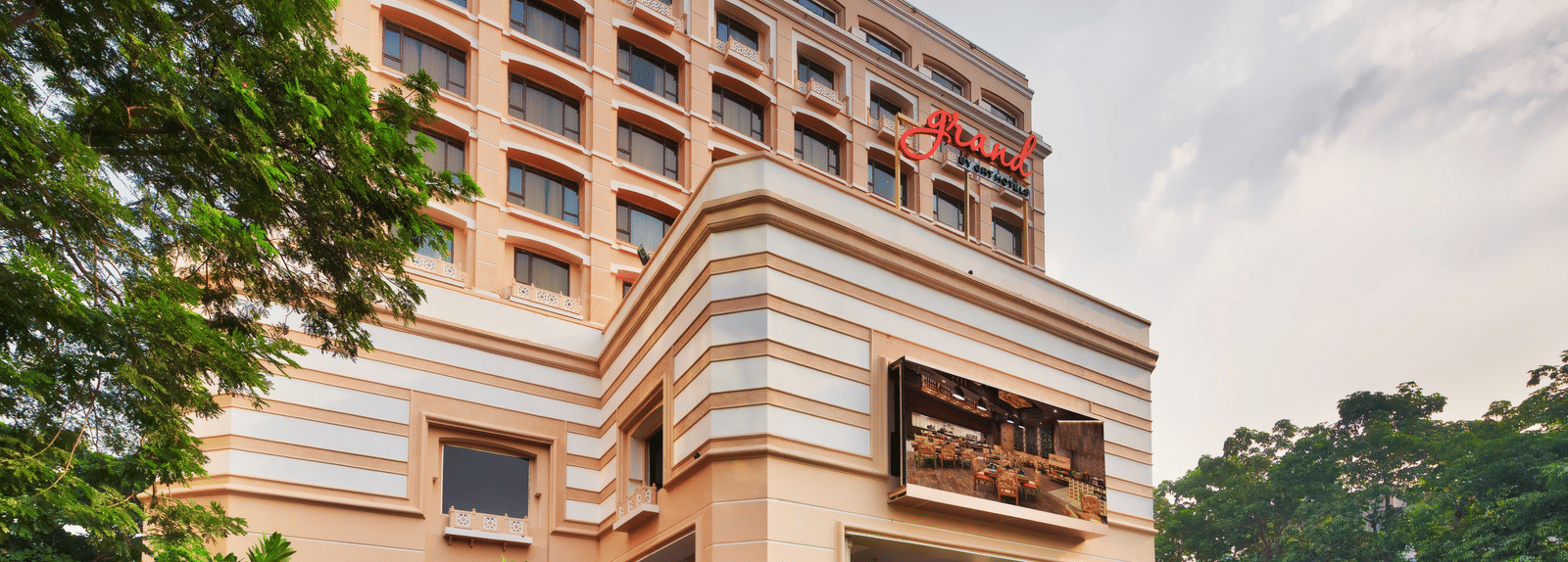 Facade of Grand Chennai By GRT Hotels during daytime.