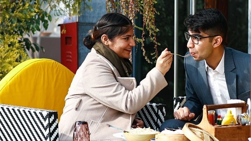 A couple having lunch at Karma lakelands.