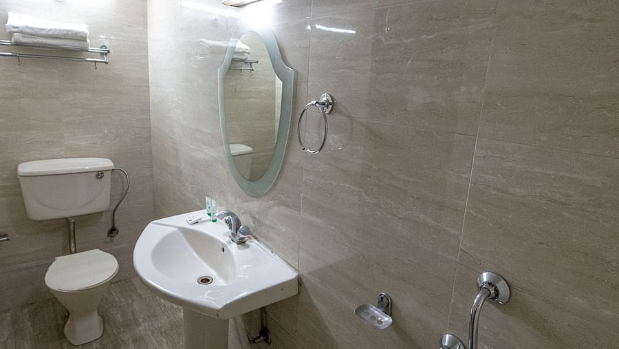 Washroom with a sink in standard room at Himalaya Hotel, Nainital