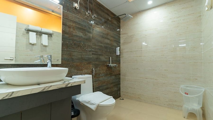 A bathroom with a sink and a toilet, modern design - Clarks Exotica Resort, Near Mukhteshwar.