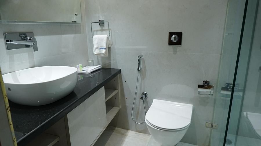 Contemporary bathroom with sleek fittings at Kalyan Residency Hotel, Tirupati – designed for a fresh and clean experience.