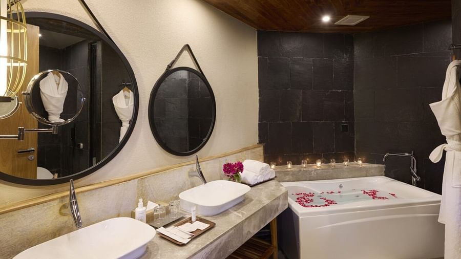 A luxurious bathroom with freestanding bathtub, twin vanities, and walk-in shower - Royal Tulip, Chitwan