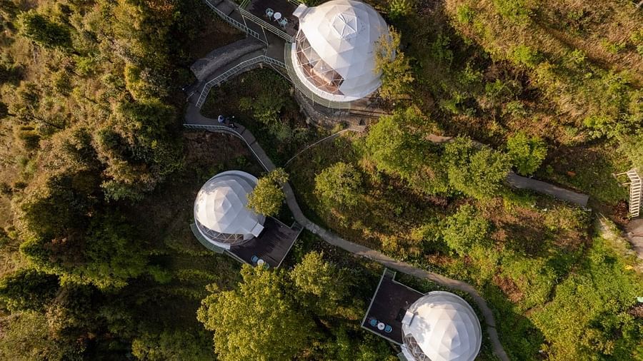 drone image of dome cottages amidst the nature| Avalon Cottages, Kanatal