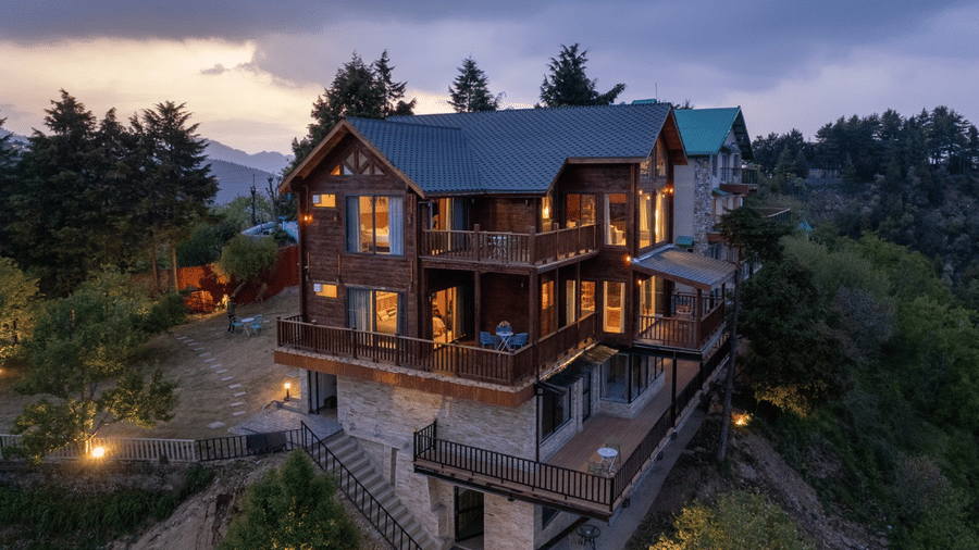 A well lit cottage cottage with trees all around | Avalon Cottages, Kanatal