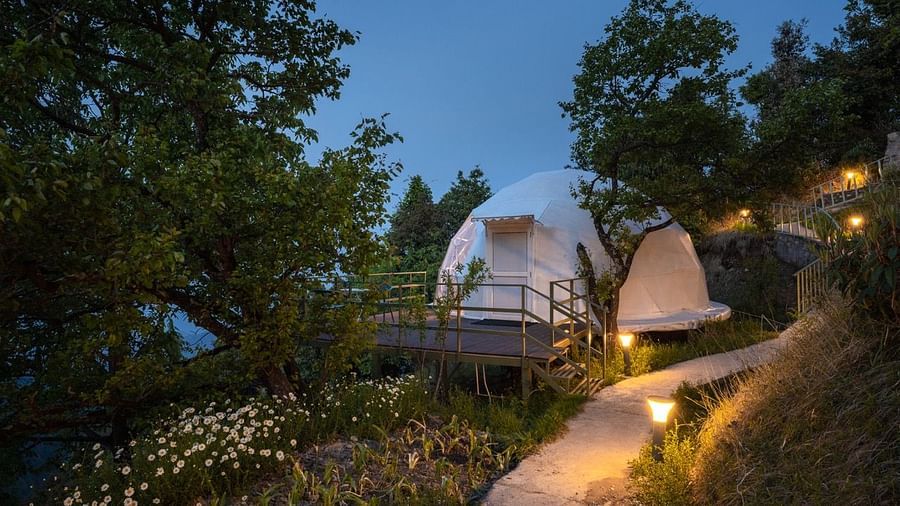 A facade of a dome cottage in the evening | Avalon Cottages, Kanatal