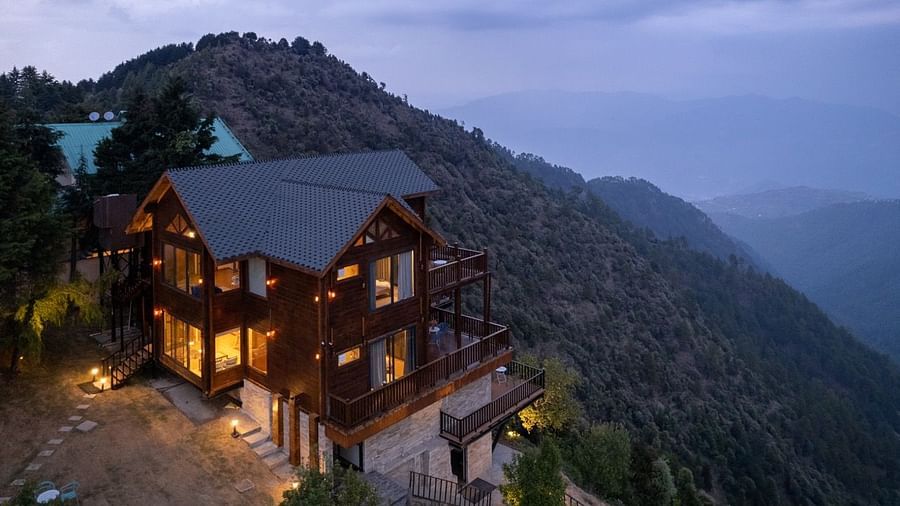 An image of a well lit cottage cottage with trees all around | Avalon Cottages, Kanatal
