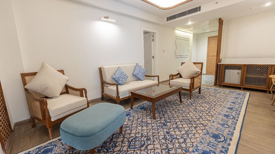 A close up shot of the couch set placed over the long patterned rug in the separate living area at Bhagirathi by RDB Atishay.