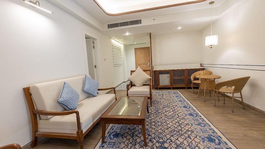 Side profile of the living area of the Ananta Room featuring a beige coloured couch at Bhagirathi by RDB Atishay.