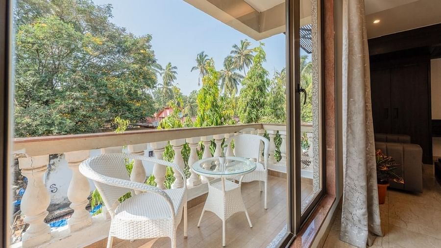 Image of Premium Room Balcony with two chairs and a table at Calux Joia Do Mar Resort, Goa.