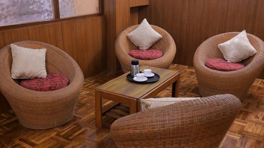 An image of a seating arrangement with bamboo sofa set at the family room in Sumitel Chiminda, Pelling