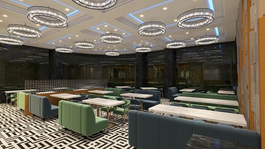 A restaurant with round, decorative lights hanging from the ceiling at Hotel Mumbai House, Vashi.