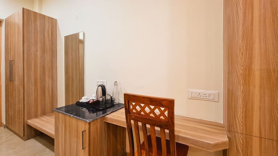 Deluxe Room with study table and chair at Pines and Peaks, Dalhousie 