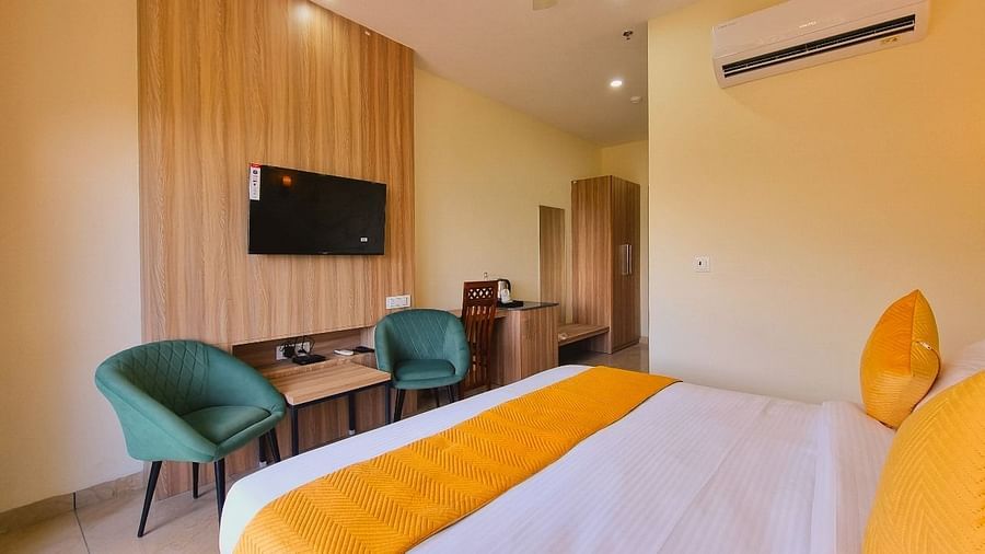 Premium Room Valley View With with bed, chiars, television at Pines and Peaks, Dalhousie 