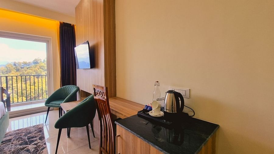Premium Room Valley View with seating area, chairs and balcony at Pines and Peaks, Dalhousie 