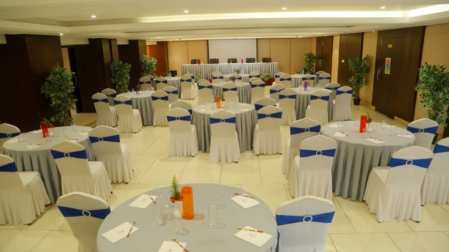 Custer style seating arrangement in a banquet hall at The Hamuse Hotel, Kodaikanal