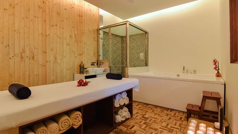 Image of interior of a  spa with bed at Shaheen Bagh Resort Dehradun