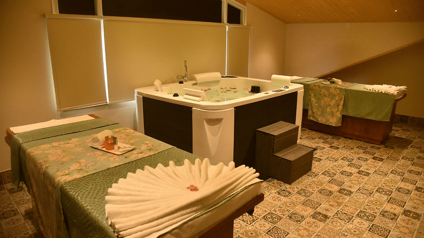 Massage table with a jacuzzi inside the spa - The Orchid Hotel Shimla