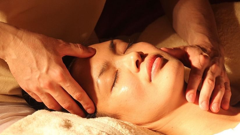 A close shot of a person's face being massaged | The Resort