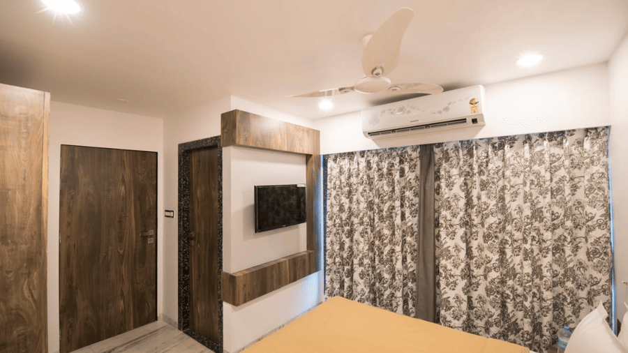The royal suite of sanmukh by Adamo showcasing the wooden interior and clean ambience.