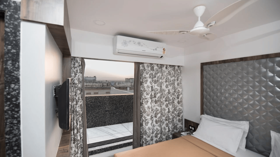 royal suite room with its posh interiors and a spacious balcony in the view.