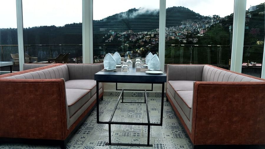 The seating arrangement in The House of Glass, a rooftop restaurant in Shimla - The Orchid Hotel Shimla
