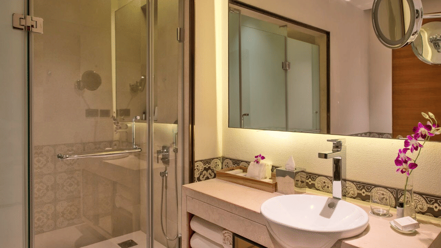 Bathroom with glass shower cubicle and a large mirror
