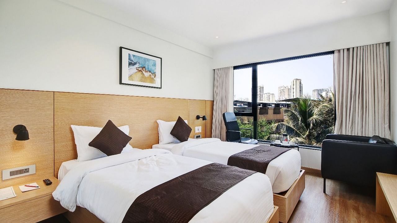 Premium room with twin beds and a balcony at Hotel Mumbai House, Ghansoli