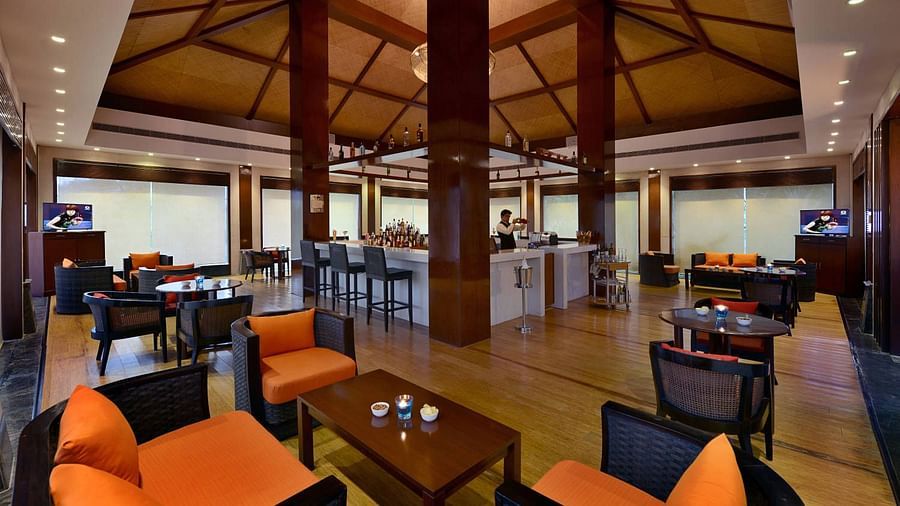 Seating arrangements with a coffee table inside Float Bar - The Ananta Udaipur