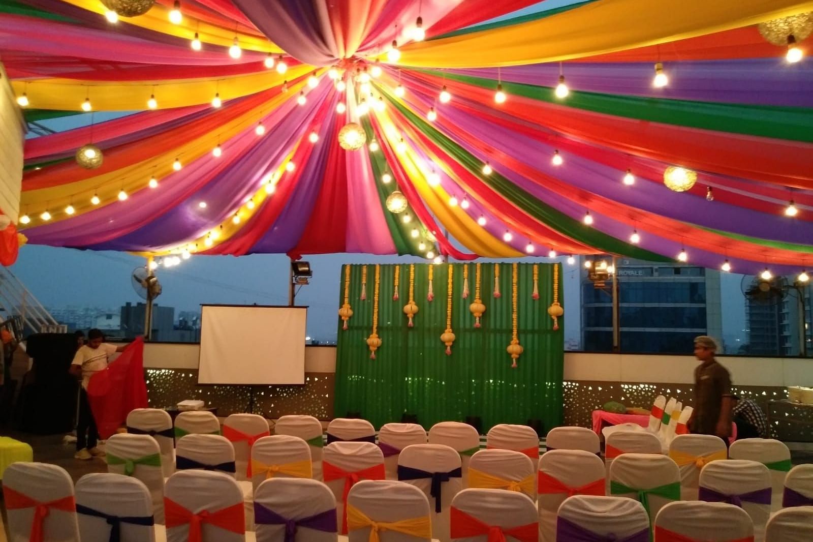 Image of an outdoor event space with chairs and light above at The Oriental Residency