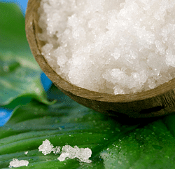 Sea salt cup pictured on a macro shot while positioned on a leaf for aesthetic purposes