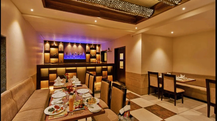 Restaurant with luxurious interior for comfortable dining at Ramanashree Richmond.
