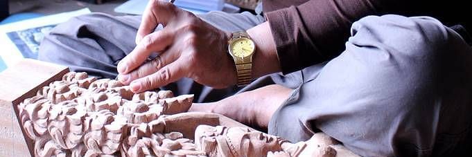 A man sculpting a sculpture