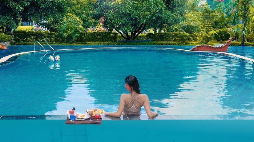 Poolside dining and stay offers at The Tattwaa Corbett Spa & Resort with exclusive group benefits.