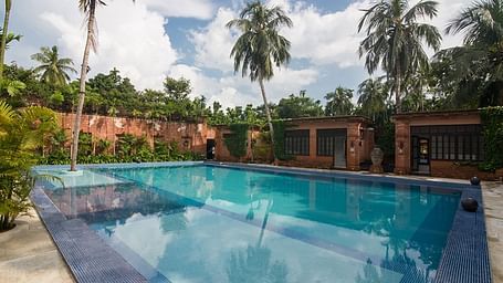 A swimming pool at The Rajbari Bawali