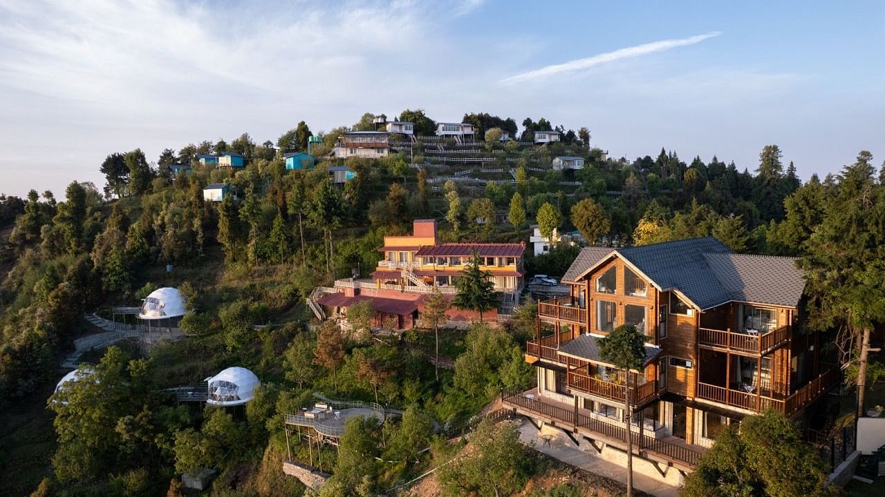 An image of a mountain area with several cottages and dome style cottages 