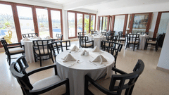restaurant with chairs at White Pearl Resort by Rosetum