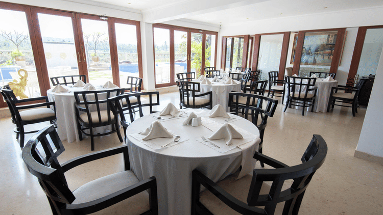 restaurant with chairs at White Pearl Resort by Rosetum