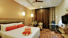 Club Premier with two cream plush sofas