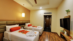 Club Room with plush twin beds and white linens