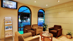 creme ceramic tiles with four plush sofas