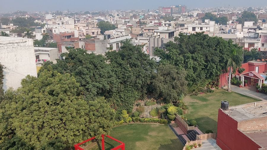 A bird eye shot of the lawn at Hotel Gold, Panipat with the mesmerising skyline of the city.