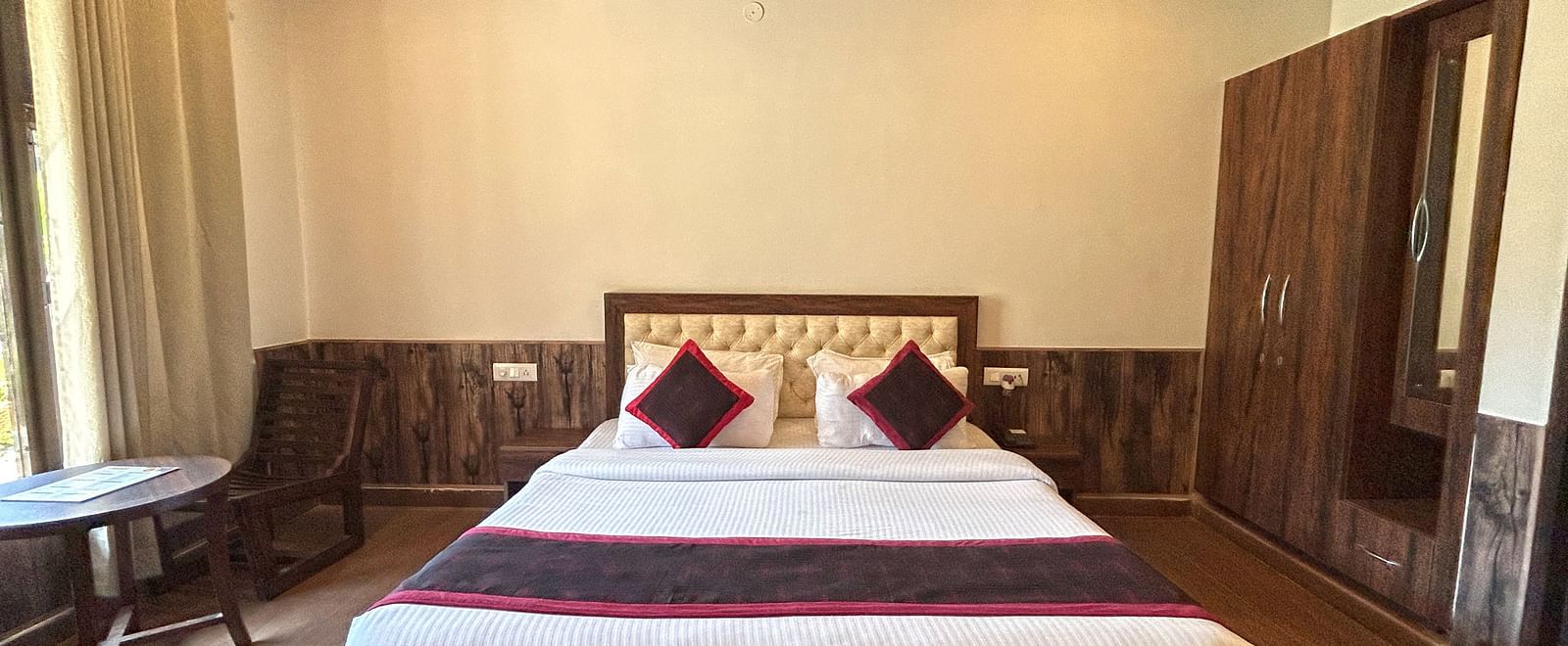 Luxury Cottage with a large bed at DLS MJ River Resort, Rishikesh.