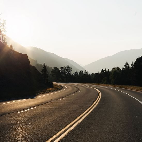 Picture of a road with mountain background