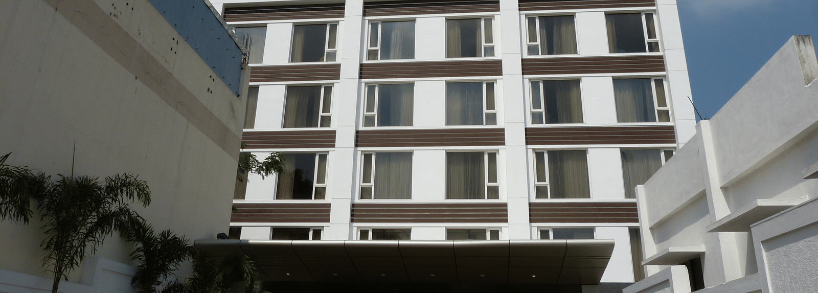 The hotel's facade stands out against a clear sky