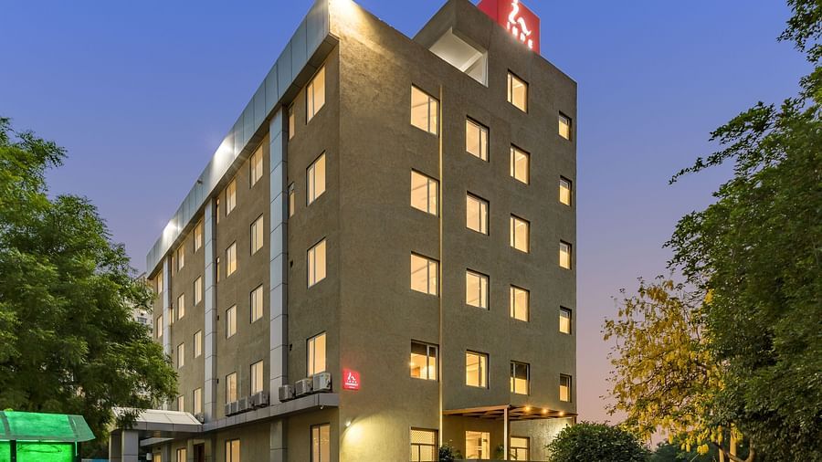 Facade image of  Inde Hotel Cyber City with backdrop of blue sky