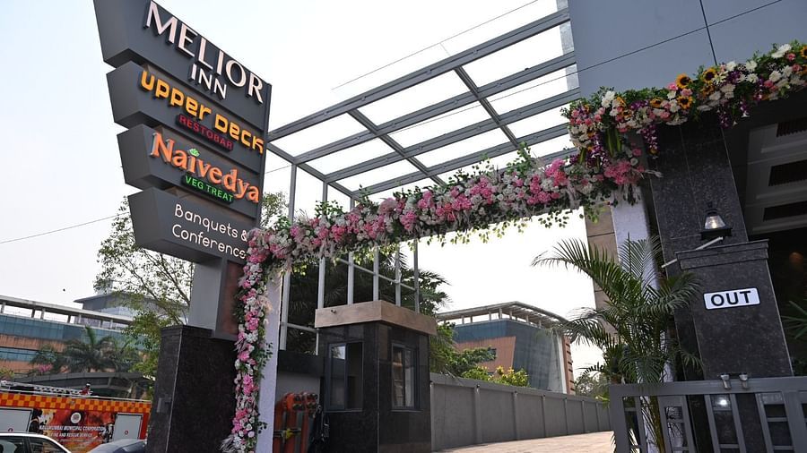 An exterior view of the entrance of Melior Inn with signage and some decoration.